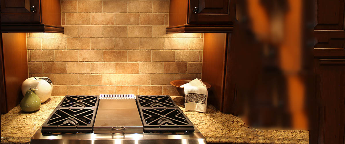 A modern cooktop in a kitchen in an upscale luxurious american home