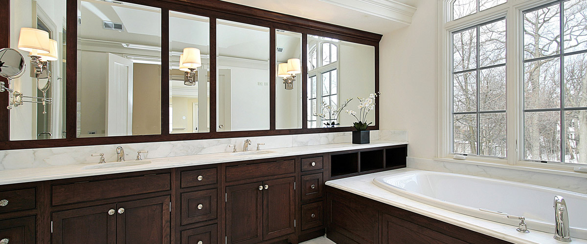 Master bath with dark cabinetry